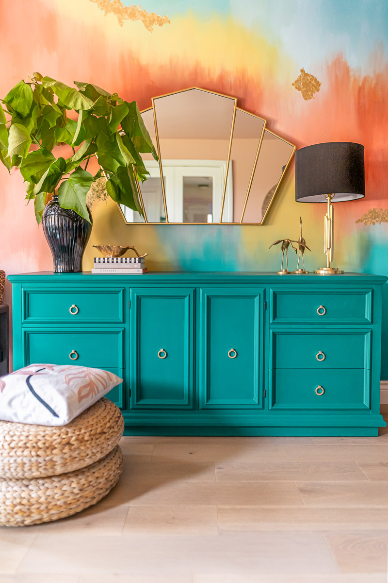 teal credenza with mirror and water colour wall mural